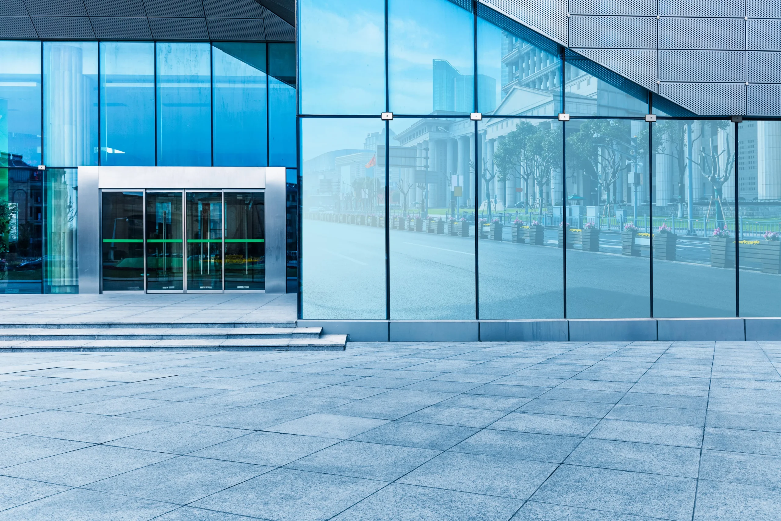 A glass building exterior in blue tones