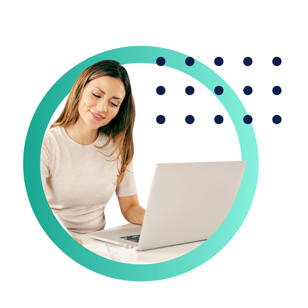 A business man in a blue buttoned shirt looks at a document while sitting at his desk in front of a computer, all placed inside of a designed green circle.