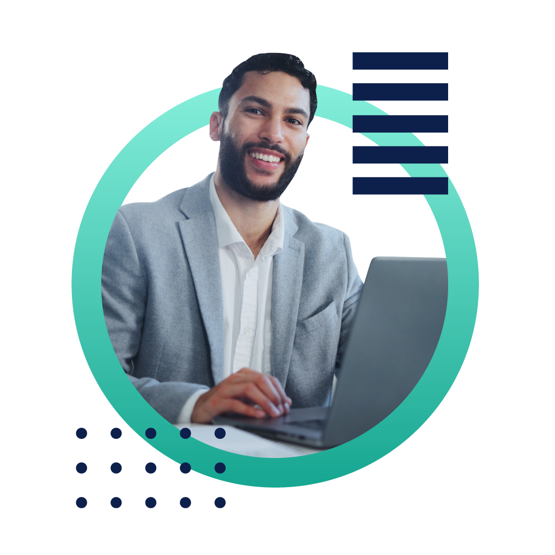 A business woman in a tan suit reading a document and sitting at her desk in front of a computer, inside of a designed green circle.