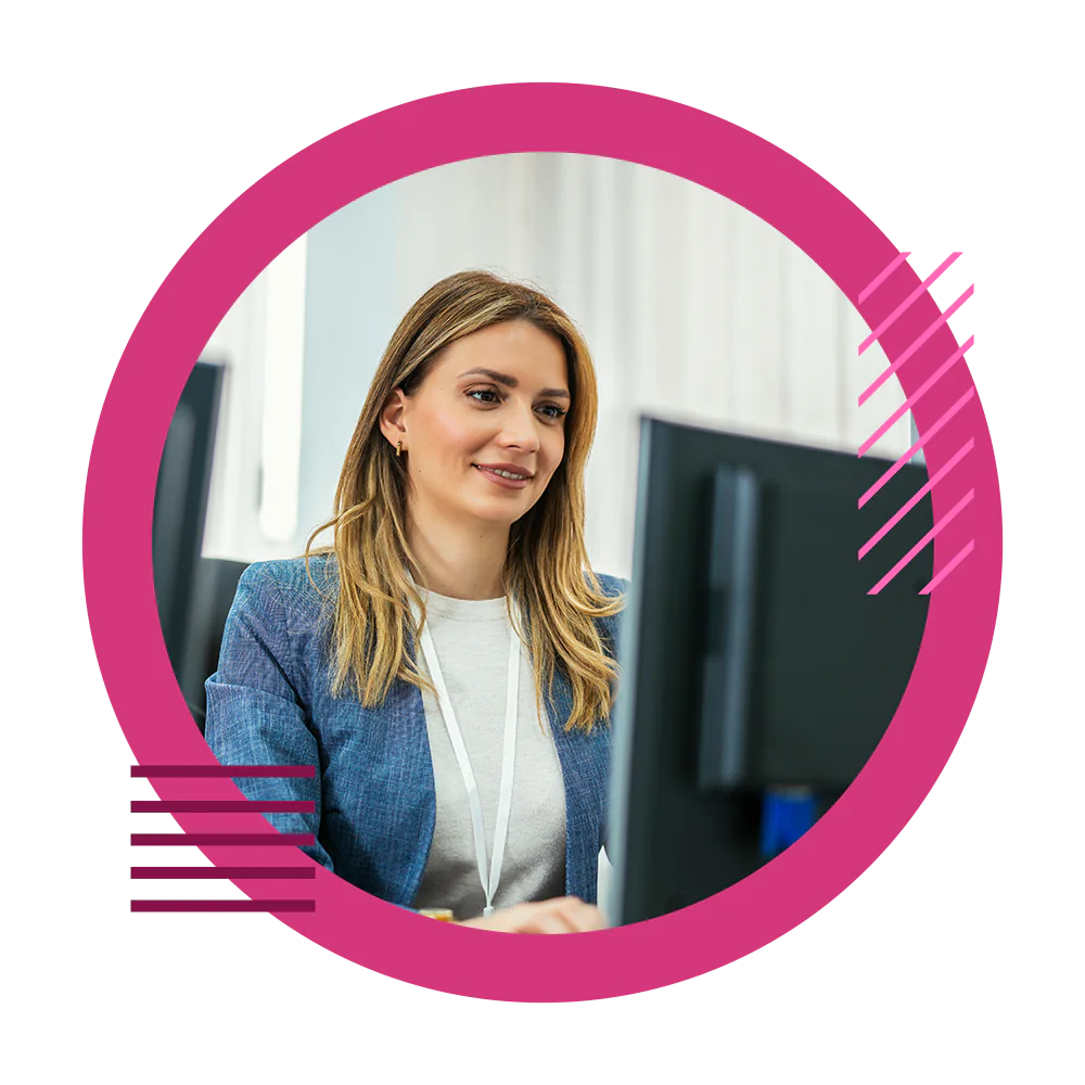 An elderly gentleman on a device in a warehouse.