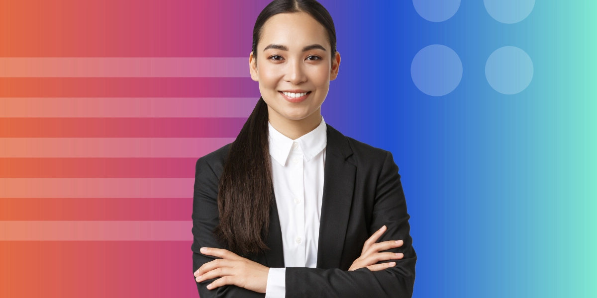 A woman in a blazer smiling.