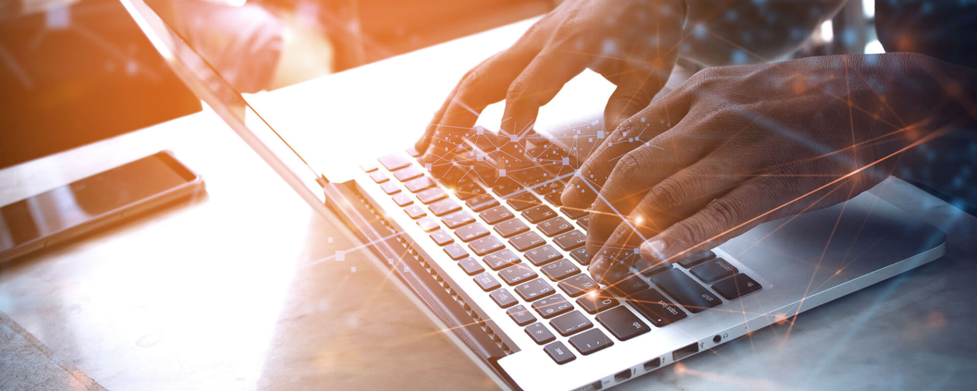 CE-header A man typing on a laptop.