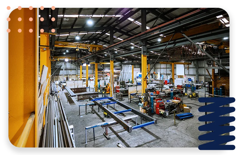 An office with cool lighting and business coworkers sitting at a table in a meeting.