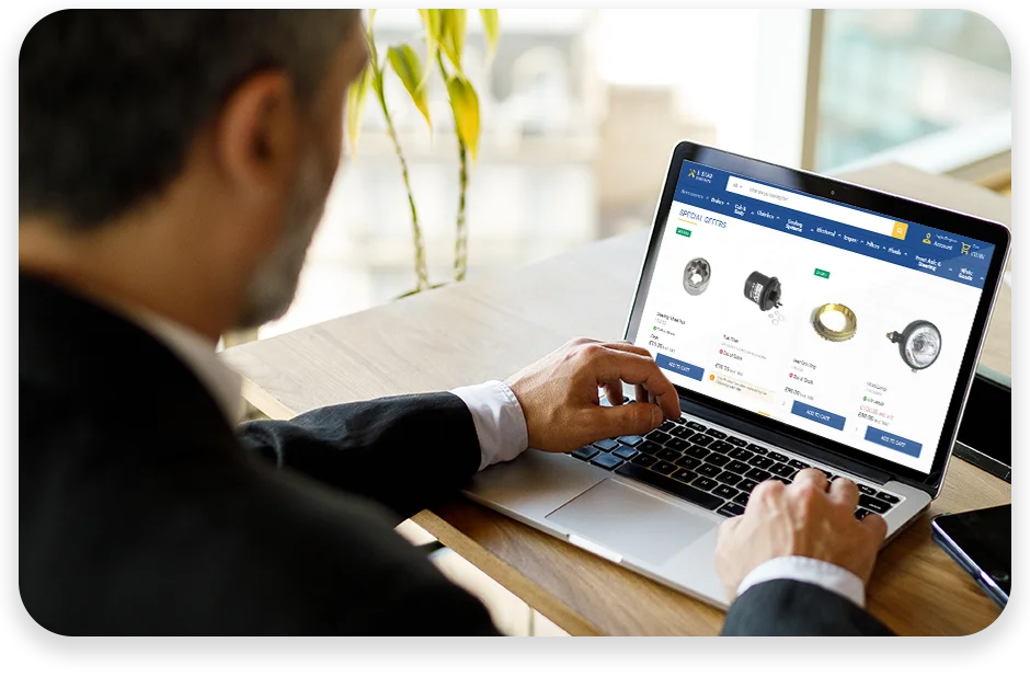 DC7 Experlogix Digital Commerce spare parts screenshot on a laptop of a man using the device in an office.