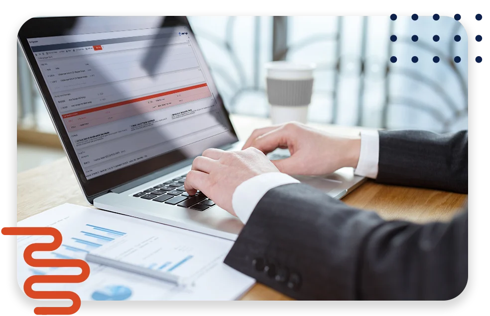 An office with cool lighting and business coworkers sitting at a table in a meeting.