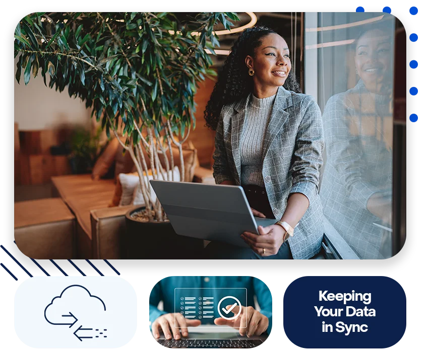 A woman looking out the window and smiling in an office, while holding her laptop. The text "Keeping your Data in Sync" is also displayed.