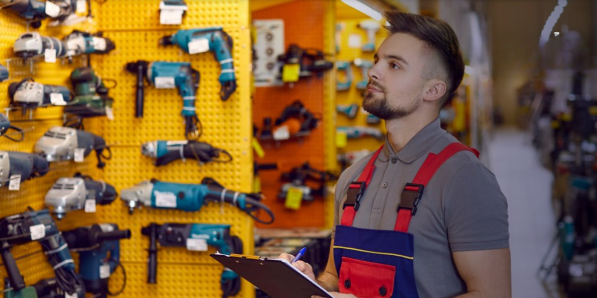 United Hardware B2B ecommerce employee reviewing inventory tools in store